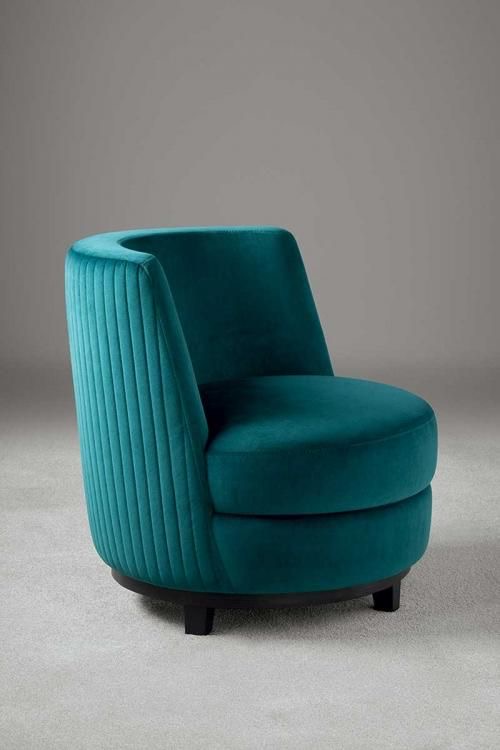 Luxurious teal velvet curved ottoman
