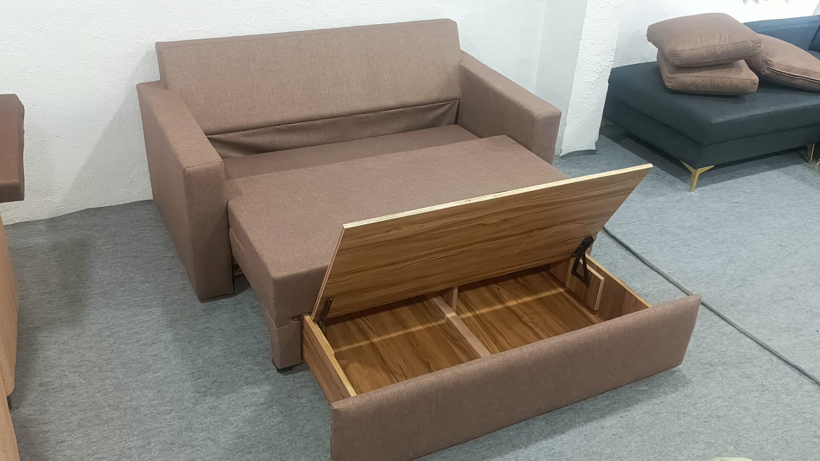 Compact brown 3 Seater sofa cum bed with storage box