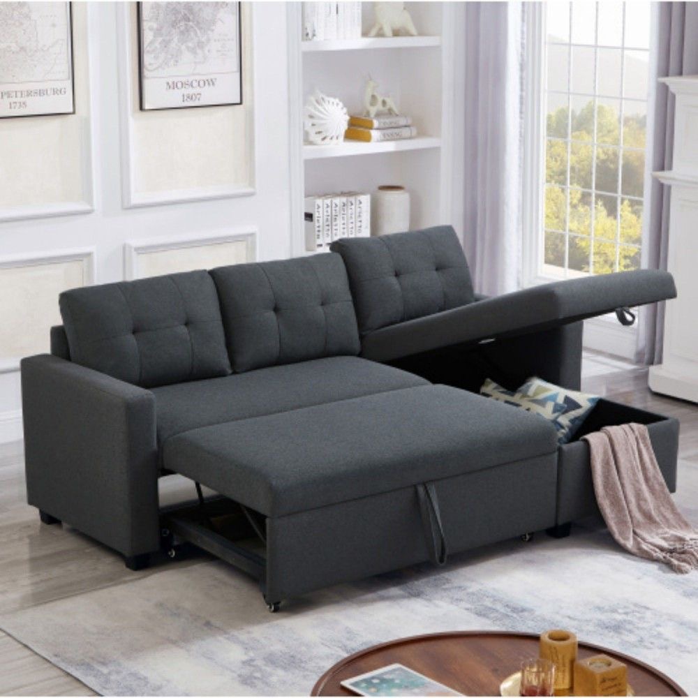 Dark grey 3 Seater sofa cum bed with hidden storage compartments and pull-out bed in a modern living room