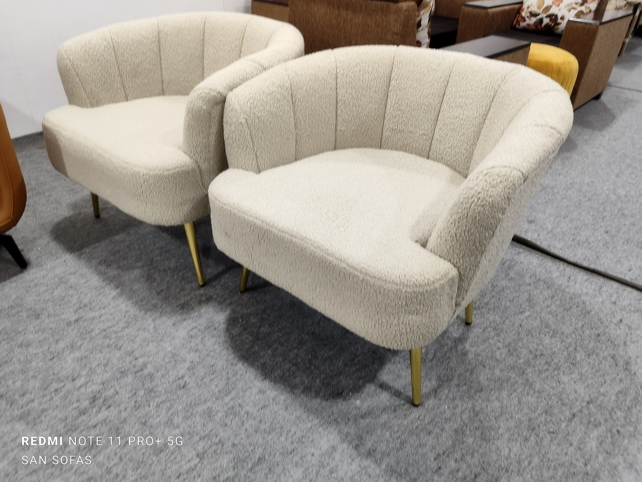 Pair of boucle-textured beige accent chairs