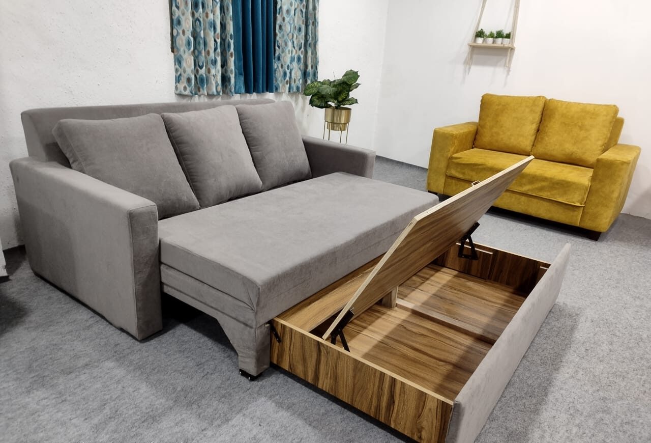 Stylish grey sofa cum bed with open wooden storage drawer for modern living room