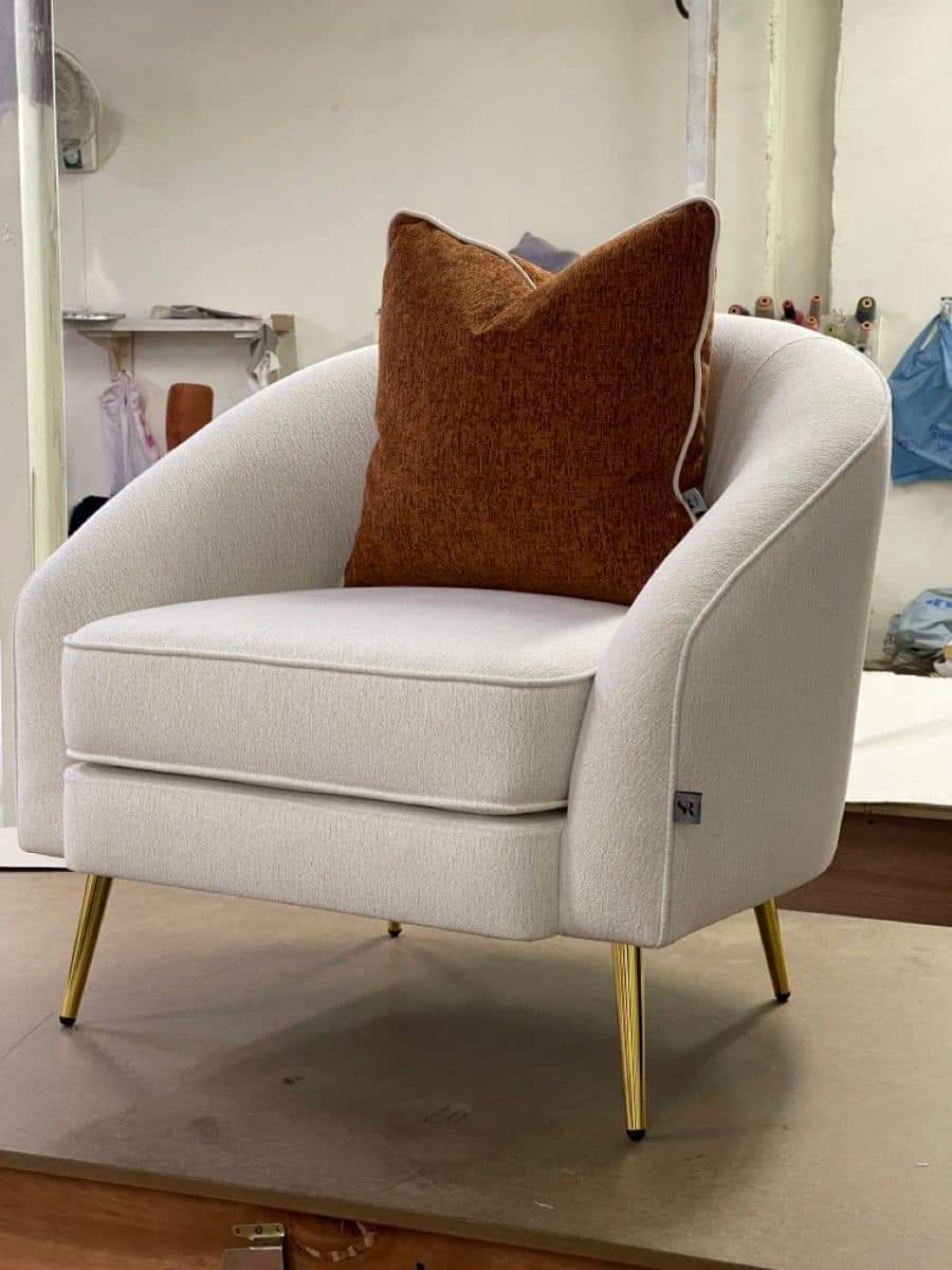 White accent chair with brown colour